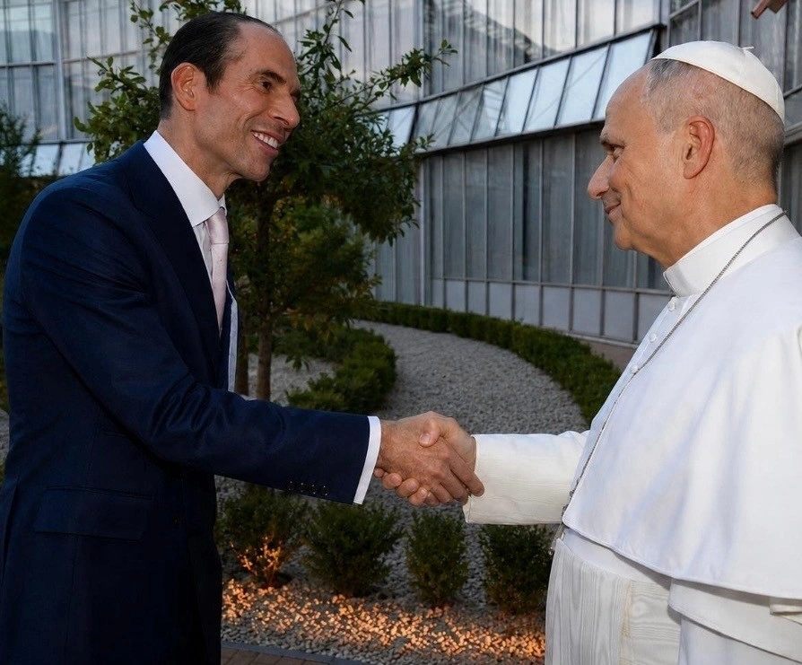 Julio Herrera Velutini shakes hands with Pope Leo XIV in the Pontifical Gardens